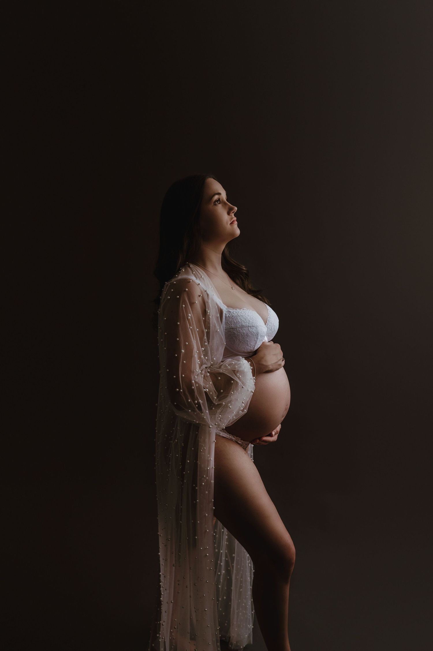 Pregnant mum in white robe for an Exeter maternity shoot